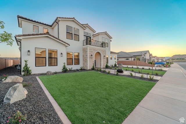 3092 E 2110th St S, St George, UT 84790 - view of front of home with a balcony, a tile roof, stone siding, and stucco siding