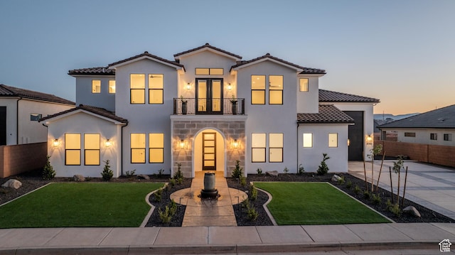 3092 E 2110th St S, St George, UT 84790 - mediterranean / spanish-style home with a balcony, a tiled roof, stucco siding, driveway, and stone siding