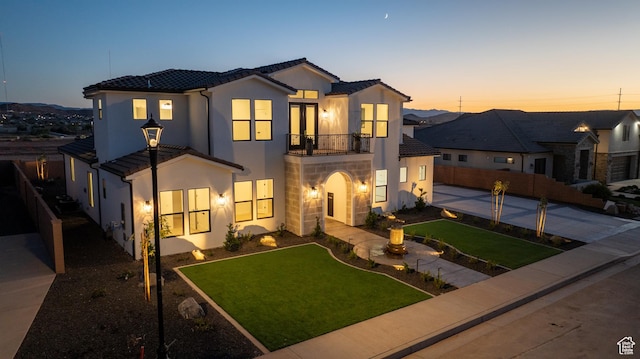 3092 E 2110th St S, St George, UT 84790 - view of front facade featuring a balcony, stucco siding, stone siding, and a tile roof