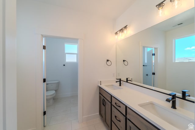 3092 E 2110th St S, St George, UT 84790 - bathroom with toilet, double vanity, tile patterned flooring, and baseboards