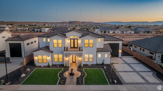 3092 E 2110th St S, St George, UT 84790 - mediterranean / spanish-style house featuring concrete driveway, a balcony, a tile roof, and stucco siding
