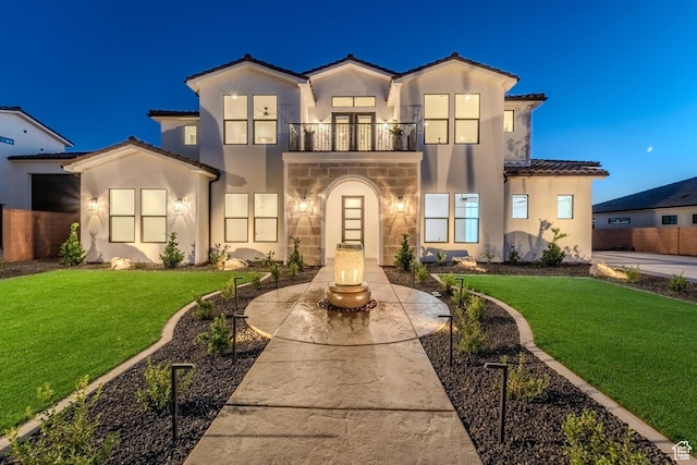 3092 E 2110th St S, St George, UT 84790 - mediterranean / spanish home featuring a balcony, stucco siding, a tiled roof, and stone siding