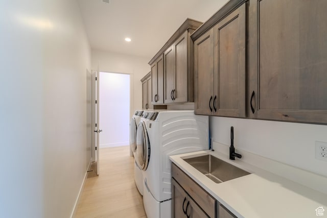 3092 E 2110th St S, St George, UT 84790 - washroom with cabinet space, washing machine and dryer, baseboards, recessed lighting, and light wood-type flooring