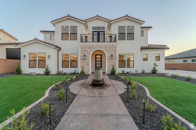 3092 E 2110th St S, St George, UT 84790 - mediterranean / spanish house featuring a balcony, a tile roof, stucco siding, and stone siding