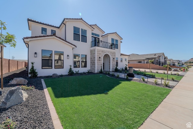 3092 E 2110th St S, St George, UT 84790 - mediterranean / spanish-style house with a balcony, stucco siding, stone siding, and a tiled roof