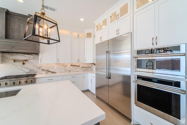 3092 E 2110th St S, St George, UT 84790 - kitchen featuring appliances with stainless steel finishes, tasteful backsplash, decorative light fixtures, white cabinetry, and recessed lighting