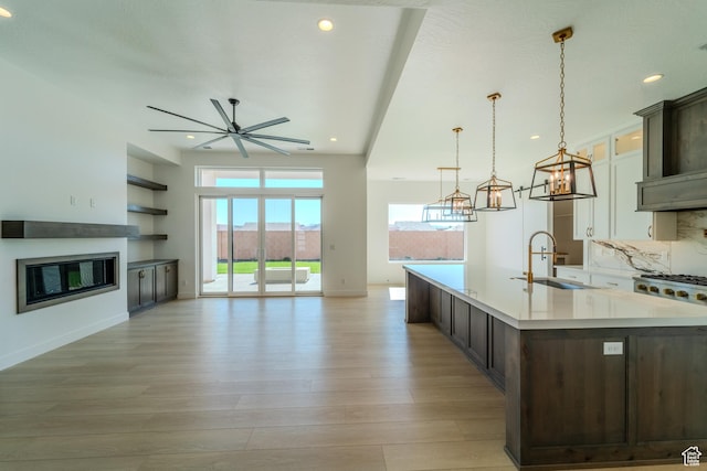 3092 E 2110th St S, St George, UT 84790 - kitchen with a sink, light countertops, a large island with sink, healthy amount of natural light, and recessed lighting