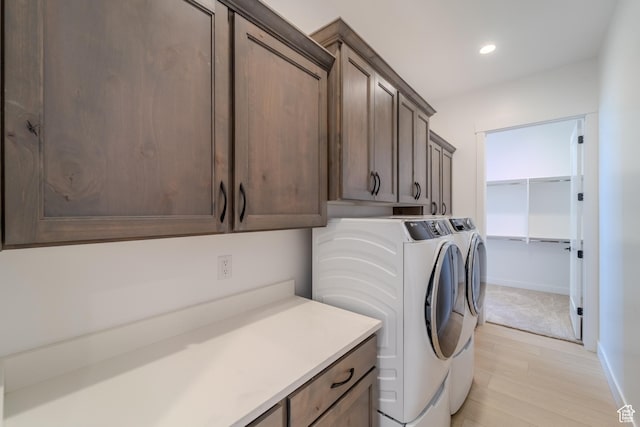 3092 E 2110th St S, St George, UT 84790 - washroom featuring cabinet space, washer and dryer, recessed lighting, light wood-style floors, and baseboards