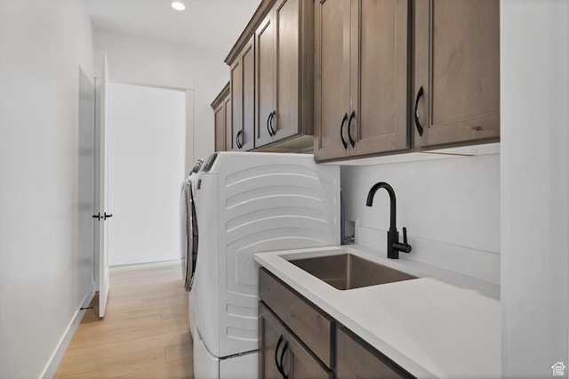 3092 E 2110th St S, St George, UT 84790 - laundry room with cabinet space, washer and clothes dryer, recessed lighting, and light wood-style floors