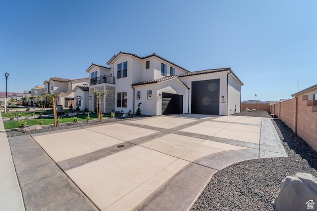 3092 E 2110th St S, St George, UT 84790 - mediterranean / spanish-style home featuring driveway, an attached garage, a tile roof, and stucco siding