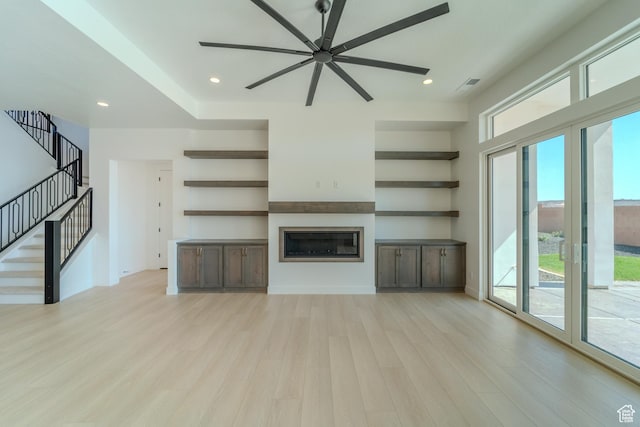 3092 E 2110th St S, St George, UT 84790 - unfurnished living room with a ceiling fan, plenty of natural light, light wood finished floors, a glass covered fireplace, and recessed lighting