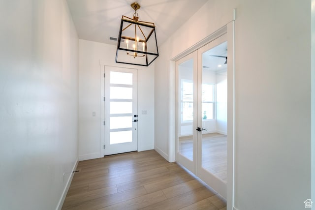 3092 E 2110th St S, St George, UT 84790 - entryway featuring french doors, a chandelier, plenty of natural light, and light wood finished floors
