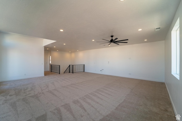 3092 E 2110th St S, St George, UT 84790 - spare room featuring light carpet, recessed lighting, ceiling fan, and baseboards