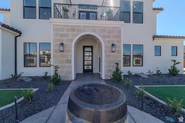 3092 E 2110th St S, St George, UT 84790 - doorway to property with stucco siding, a balcony, and a tile roof