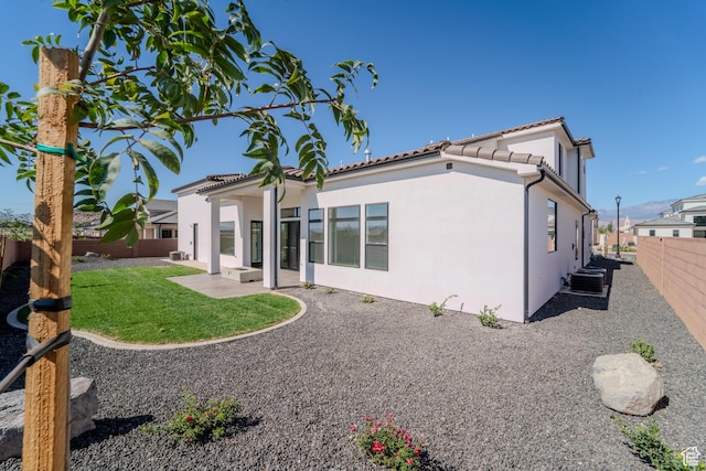 3092 E 2110th St S, St George, UT 84790 - rear view of house featuring stucco siding, central AC, a patio area, and a tiled roof
