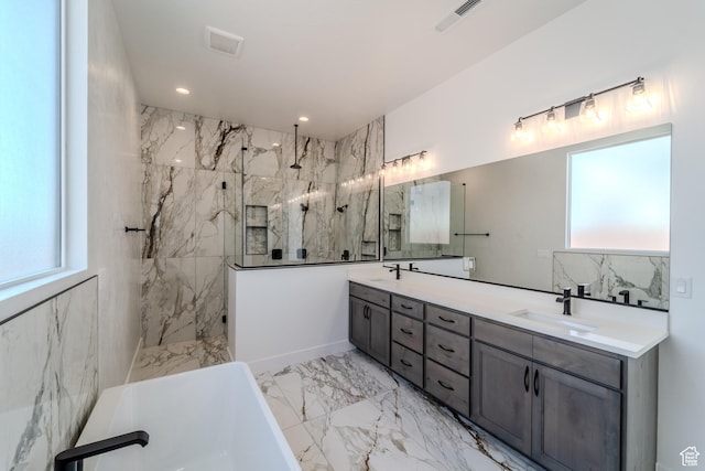 3092 E 2110th St S, St George, UT 84790 - full bath featuring marble finish floors, double vanity, a freestanding bath, a marble finish shower, and recessed lighting