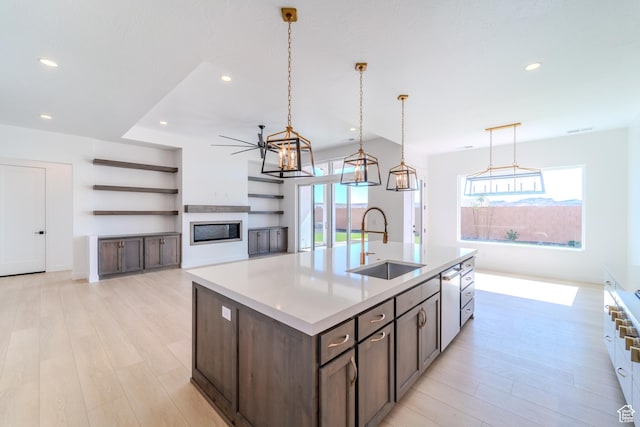3092 E 2110th St S, St George, UT 84790 - kitchen featuring a sink, light wood finished floors, light countertops, an island with sink, and recessed lighting