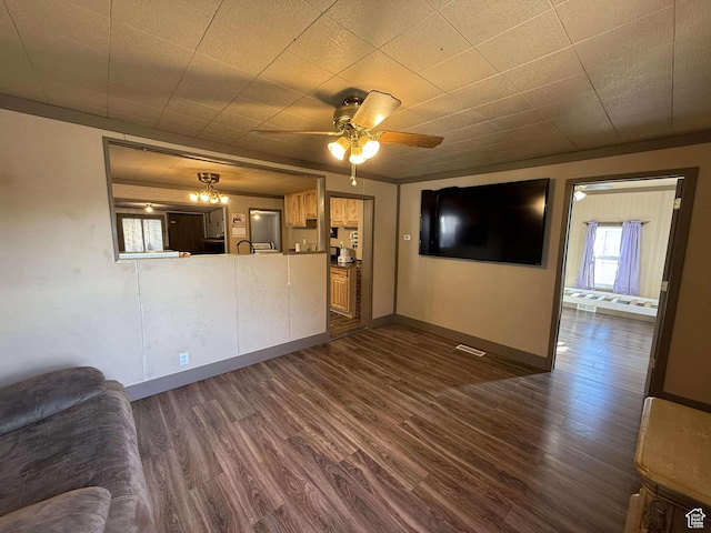unfurnished living room with dark wood-type flooring and ceiling fan