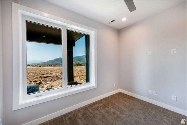 11785 N Apex Way Unit 60, Hideout, UT 84036 - unfurnished room with a ceiling fan, dark carpet, and a mountain view