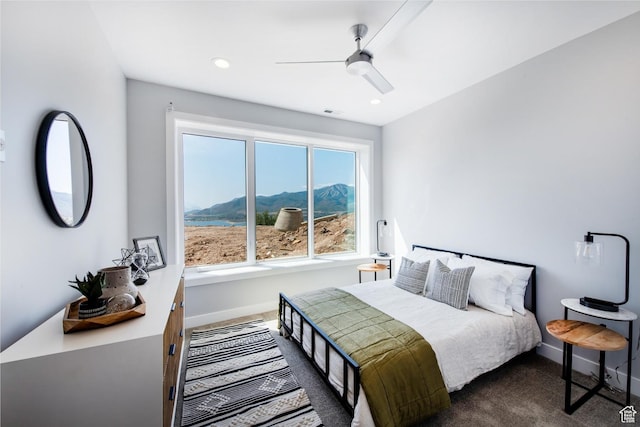 11785 N Apex Way Unit 60, Hideout, UT 84036 - bedroom with dark carpet, a mountain view, ceiling fan, and recessed lighting