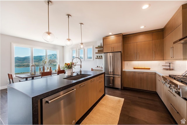 11785 N Apex Way Unit 60, Hideout, UT 84036 - kitchen with stainless steel appliances, tasteful backsplash, recessed lighting, dark wood-style flooring, and wall chimney range hood