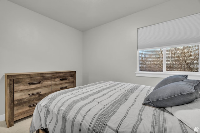 bedroom with light colored carpet