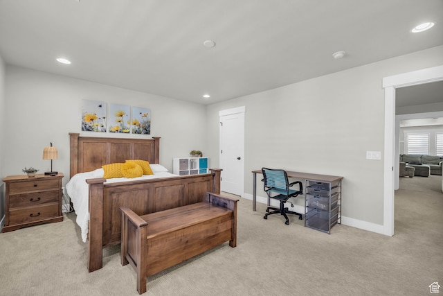 bedroom featuring light colored carpet