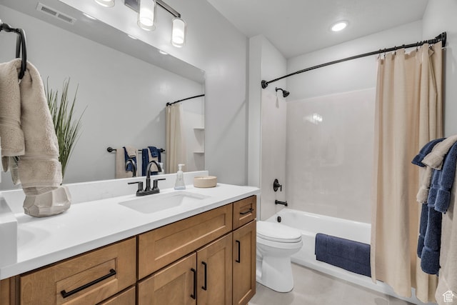 full bathroom with vanity, toilet, and shower / tub combo with curtain