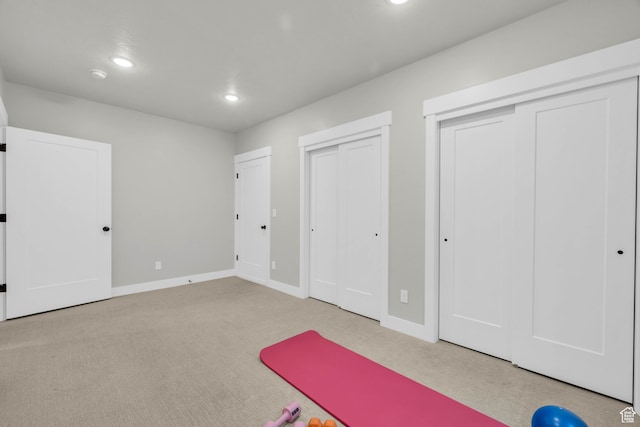 exercise area with light carpet