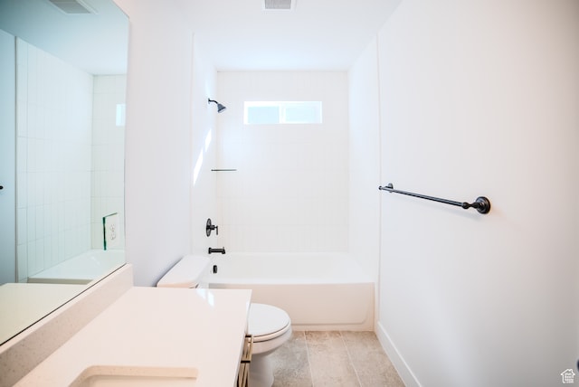 full bathroom featuring vanity, tiled shower / bath combo, and toilet