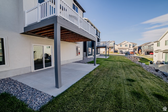 view of yard featuring a deck and a patio