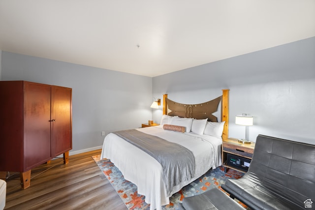 100 W 200 S Unit 103, Moab, UT 84532 - bedroom featuring hardwood / wood-style floors
