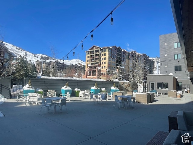 2670 W Canyons Resort Dr Unit 205, Park City, UT 84098 - snow covered patio with a mountain view and an outdoor living space