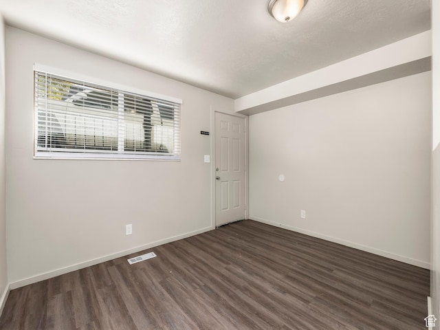 339 S 600 W, Provo, UT 84601 - unfurnished room featuring dark wood-style floors, plenty of natural light, and baseboards