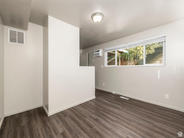 339 S 600 W, Provo, UT 84601 - unfurnished room featuring a wall unit AC, wood finished floors, and baseboards