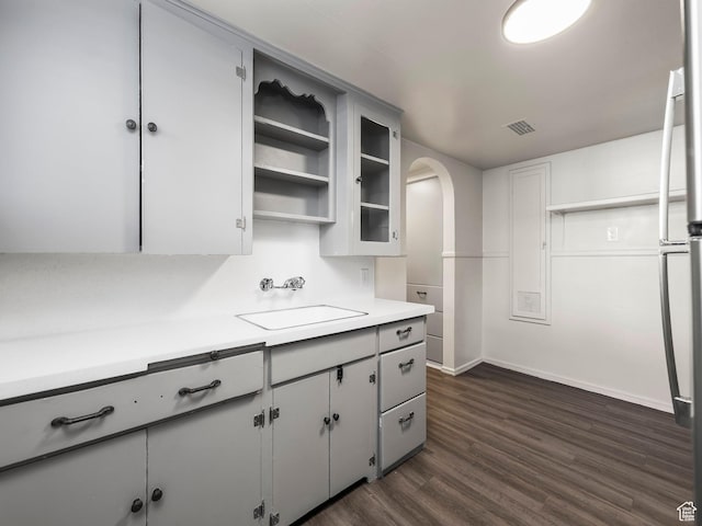 339 S 600 W, Provo, UT 84601 - kitchen featuring a sink, gray cabinetry, dark wood-style floors, light countertops, and baseboards