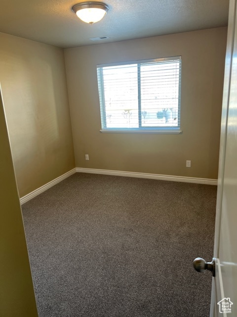 895 S Main St Unit E, Layton, UT 84041 - empty room with carpet and a textured ceiling