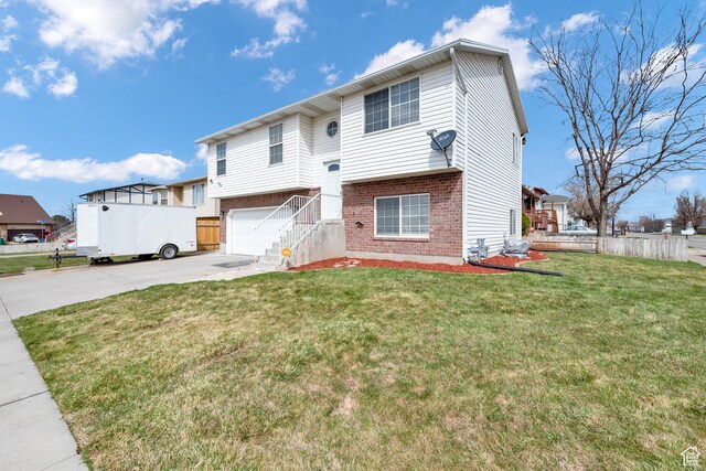 2778 W 5400 S, Roy, UT 84067 - view of front of home featuring brick siding, driveway, and an attached garage