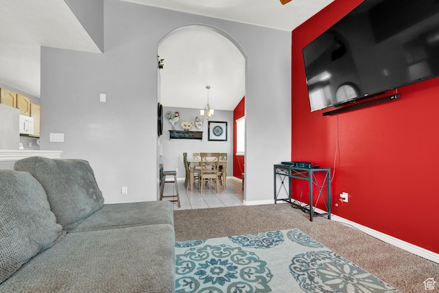 2778 W 5400 S, Roy, UT 84067 - living area featuring arched walkways, carpet floors, baseboards, and vaulted ceiling
