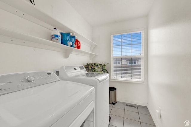 2778 W 5400 S, Roy, UT 84067 - washroom with washing machine and clothes dryer, light tile patterned flooring, and baseboards
