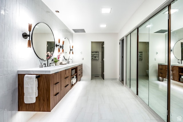 4345 S Zarahemla Dr, Salt Lake City, UT 84124 - bathroom with vanity, tile walls, and toilet
