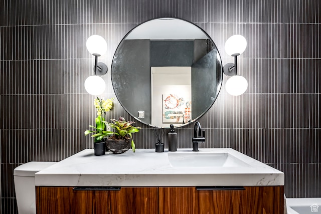 4345 S Zarahemla Dr, Salt Lake City, UT 84124 - bathroom featuring vanity, tile walls, and toilet