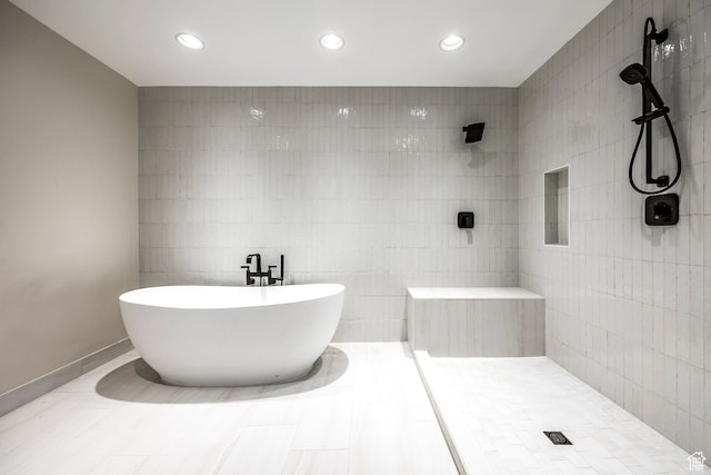 4345 S Zarahemla Dr, Salt Lake City, UT 84124 - bathroom with tile patterned floors, tile walls, and independent shower and bath