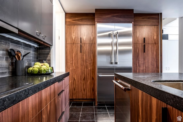 4345 S Zarahemla Dr, Salt Lake City, UT 84124 - kitchen featuring backsplash, stainless steel appliances, and dark tile patterned flooring