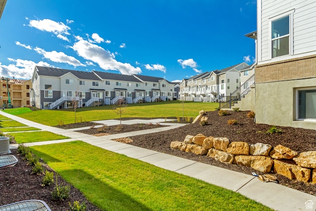 view of property's community featuring a yard