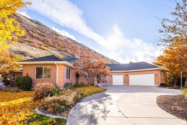 view of front of house featuring a mountain view and a garage