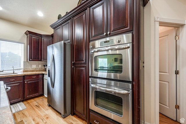 618 E Draper Heights Way S, Draper, UT 84020 - kitchen with sink, light stone countertops, light wood-type flooring, tasteful backsplash, and stainless steel appliances