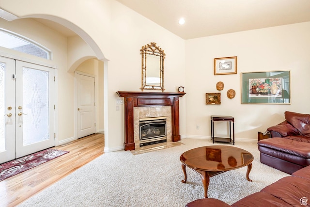618 E Draper Heights Way S, Draper, UT 84020 - living room with a fireplace, french doors, and light wood-type flooring