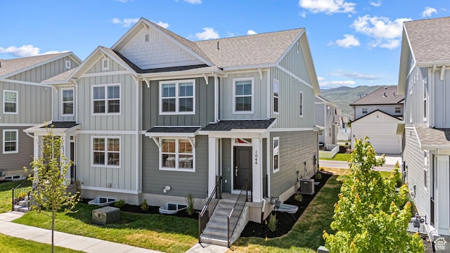 1044 E 1930 S Unit 419, Heber City, UT 84032 - view of front of home featuring board and batten siding, roof with shingles, a front lawn, and a residential view