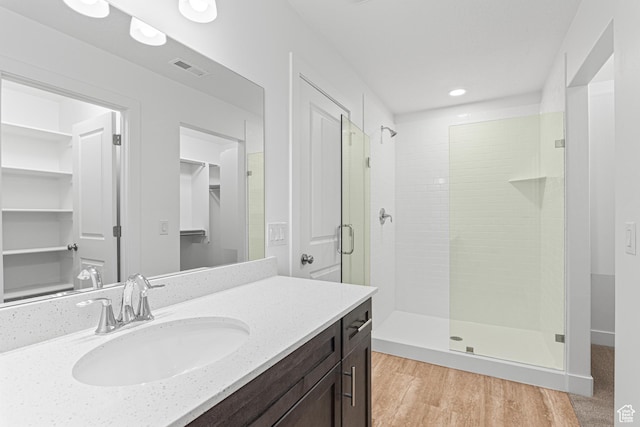 1044 E 1930 S Unit 419, Heber City, UT 84032 - full bath featuring a stall shower, vanity, a spacious closet, wood finished floors, and recessed lighting
